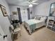 Bedroom with a queen bed, desk, chair, and window coverings at 3721 Monday Ter, North Port, FL 34286