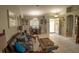 Living room features a brown leather couch and dining area at 3721 Monday Ter, North Port, FL 34286