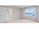Bedroom with water view and large window at 1781 W Palms Dr, Port Charlotte, FL 33953