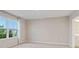 Bright bedroom with large window and neutral wall colors at 1781 W Palms Dr, Port Charlotte, FL 33953