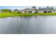House with backyard and covered patio overlooking a lake at 1781 W Palms Dr, Port Charlotte, FL 33953