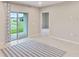 Bright living room with sliding glass doors and lake view at 1781 W Palms Dr, Port Charlotte, FL 33953