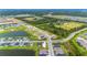 Aerial view of a new home community with open space and undeveloped land at 1781 W Palms Dr, Port Charlotte, FL 33953