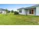 Backyard patio, grassy lawn, and birds at 1781 W Palms Dr, Port Charlotte, FL 33953