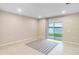 Living room with sliding glass doors to a lake view at 1781 W Palms Dr, Port Charlotte, FL 33953