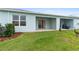 Backyard patio, grassy lawn, and birds at 1781 W Palms Dr, Port Charlotte, FL 33953