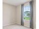 Bright bedroom with window and neutral decor at 1781 W Palms Dr, Port Charlotte, FL 33953