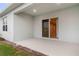Covered patio with sliding glass doors and a view of the backyard at 1781 W Palms Dr, Port Charlotte, FL 33953