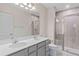 Bathroom with double vanity and large shower at 1781 W Palms Dr, Port Charlotte, FL 33953