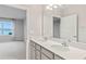Bathroom with double vanity and access to bedroom at 1781 W Palms Dr, Port Charlotte, FL 33953