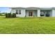 Backyard patio, grassy lawn, and birds at 1781 W Palms Dr, Port Charlotte, FL 33953