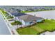 Aerial view of a charming home with a two-car garage and landscaped yard at 1781 W Palms Dr, Port Charlotte, FL 33953