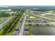 Aerial view of a community with various houses and a waterway at 1781 W Palms Dr, Port Charlotte, FL 33953