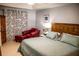 Bright Primary bedroom featuring a king bed and relaxing sitting area at 3721 Monday Ter, North Port, FL 34286