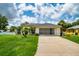 House exterior with a well-manicured lawn at 3721 Monday Ter, North Port, FL 34286