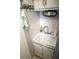 Small laundry room with utility sink and storage at 3721 Monday Ter, North Port, FL 34286