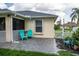 Backyard patio with blue chairs and pavers at 3721 Monday Ter, North Port, FL 34286