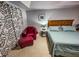 Relaxing bedroom with a comfortable bed and sitting area at 3721 Monday Ter, North Port, FL 34286