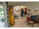 Living room, view from kitchen area, shows a brown leather couch at 3721 Monday Ter, North Port, FL 34286