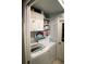 Laundry room with washer, dryer, cabinets, and shelving for storage at 3721 Monday Ter, North Port, FL 34286