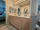 Double vanity bathroom with ample storage and modern fixtures at 3721 Monday Ter, North Port, FL 34286
