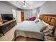 Spacious Primary bedroom with king bed, TV, and ensuite bathroom access at 3721 Monday Ter, North Port, FL 34286