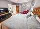 Spacious Primary bedroom with king-size bed, large TV, and sitting area at 3721 Monday Ter, North Port, FL 34286