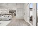 Open living room with kitchen views, modern sofa and stylish decor at 13493 Los Angeles Ave, Port Charlotte, FL 33981