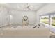 Open floor plan living room featuring a neutral color palette and lots of natural light at 13493 Los Angeles Ave, Port Charlotte, FL 33981