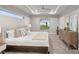 Spacious main bedroom with a comfortable bed and plenty of natural light at 13493 Los Angeles Ave, Port Charlotte, FL 33981