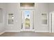 Elegant entryway with a bright, spacious feel and wood-look flooring at 13493 Los Angeles Ave, Port Charlotte, FL 33981
