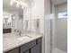 Bathroom boasts a granite countertop, modern vanity, and stylish lighting at 13493 Los Angeles Ave, Port Charlotte, FL 33981