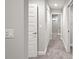 Bathroom hallway with carpet and access to closets and bathroom at 13493 Los Angeles Ave, Port Charlotte, FL 33981