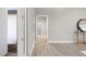 Hallway with light walls and flooring, leading to other rooms at 13493 Los Angeles Ave, Port Charlotte, FL 33981