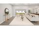 Bright and airy living room with a cozy seating area and large sliding doors leading to the backyard at 13493 Los Angeles Ave, Port Charlotte, FL 33981