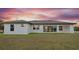 Single story home with covered patio and grassy backyard at 13493 Los Angeles Ave, Port Charlotte, FL 33981
