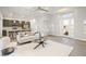 Open concept living room with kitchen views and access to the backyard at 13493 Los Angeles Ave, Port Charlotte, FL 33981