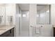 Bathroom with walk-in shower, granite countertop, and modern vanity at 13493 Los Angeles Ave, Port Charlotte, FL 33981