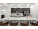 Modern kitchen with stainless steel appliances and breakfast bar at 13493 Los Angeles Ave, Port Charlotte, FL 33981