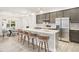 Modern kitchen with stainless steel appliances and a large kitchen island at 13493 Los Angeles Ave, Port Charlotte, FL 33981