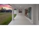 Covered patio with view of backyard and neighboring home at 13493 Los Angeles Ave, Port Charlotte, FL 33981
