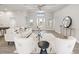 Spacious living area with a comfortable seating arrangement and access to the front door at 13493 Los Angeles Ave, Port Charlotte, FL 33981
