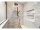 Spa-like shower with built-in shelves and bench seating at 404 Firethorn Ave, Englewood, FL 34223