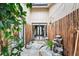 Serene Japanese garden with bamboo fence, stone path, and fountain at 404 Firethorn Ave, Englewood, FL 34223