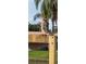 A red-shouldered hawk perches on a wooden post at 4049 Baden Dr, Holiday, FL 34691