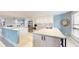 Modern kitchen featuring a large island and white cabinetry at 25188 Marion Ave # D101, Punta Gorda, FL 33950