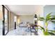 Bright home office features a comfortable sofa, workspace, and plenty of natural light at 25188 Marion Ave # D101, Punta Gorda, FL 33950