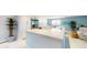 Modern kitchen with white cabinets and stainless steel appliances at 25188 Marion Ave # D101, Punta Gorda, FL 33950