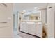 Modern bathroom with double vanity and updated fixtures at 25188 Marion Ave # D101, Punta Gorda, FL 33950