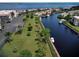 Aerial view of community, canal, and boat slips at 25188 Marion Ave # D101, Punta Gorda, FL 33950